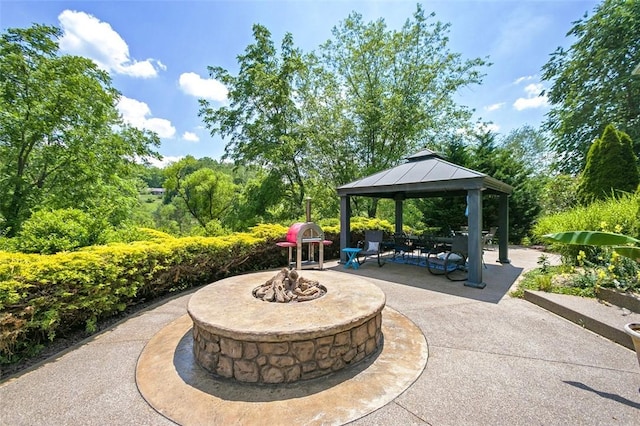 view of patio with a gazebo and an outdoor fire pit