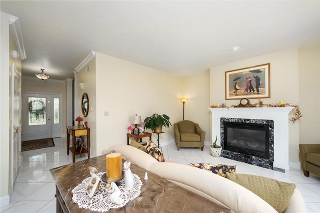 living area featuring a high end fireplace, marble finish floor, crown molding, and baseboards