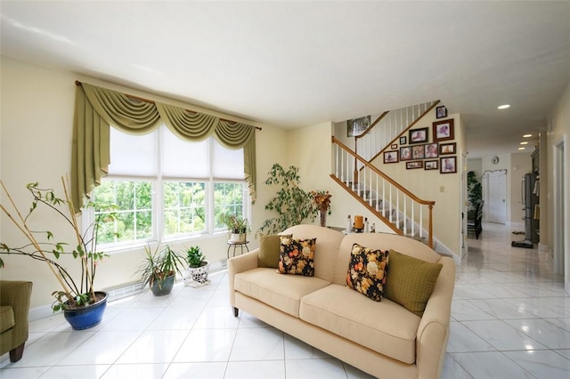 living area featuring recessed lighting, light tile patterned floors, baseboards, and stairs