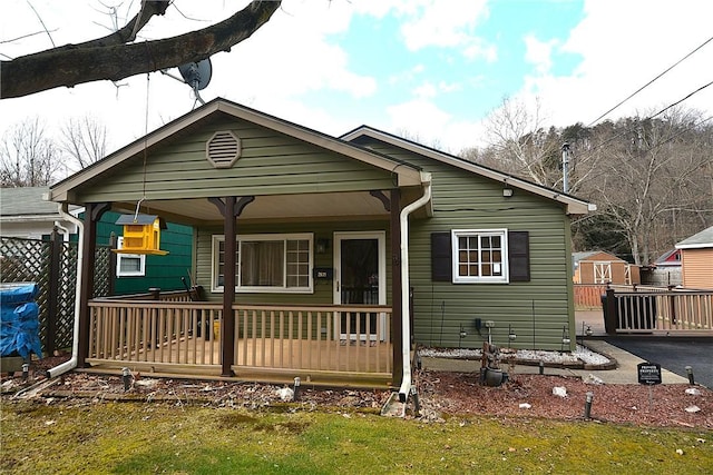 view of front of property with a porch and aphalt driveway