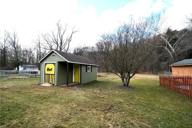 exterior space featuring fence and an outdoor structure