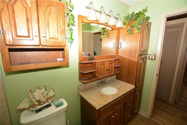 half bath with vanity and toilet