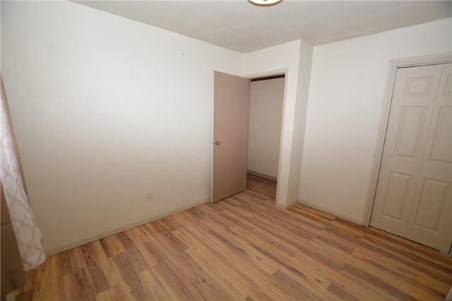 unfurnished room featuring light wood-style flooring