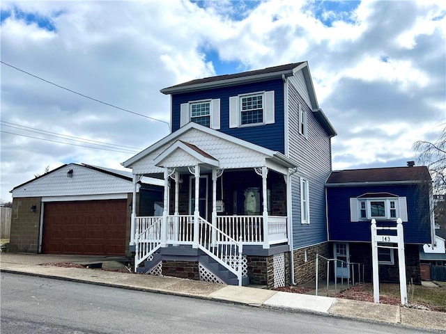 view of front of house featuring a garage and covered porch