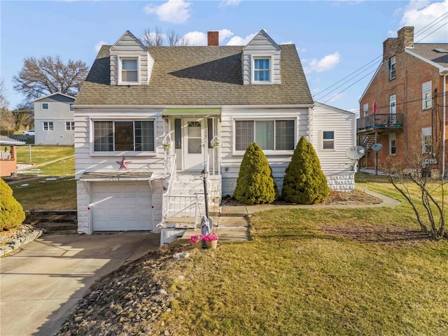 cape cod home with driveway, a chimney, roof with shingles, an attached garage, and a front yard