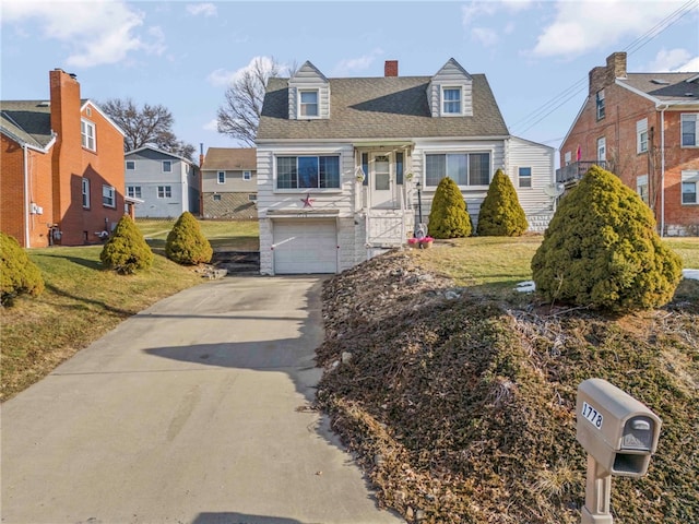 cape cod house with driveway, an attached garage, roof with shingles, and a front yard