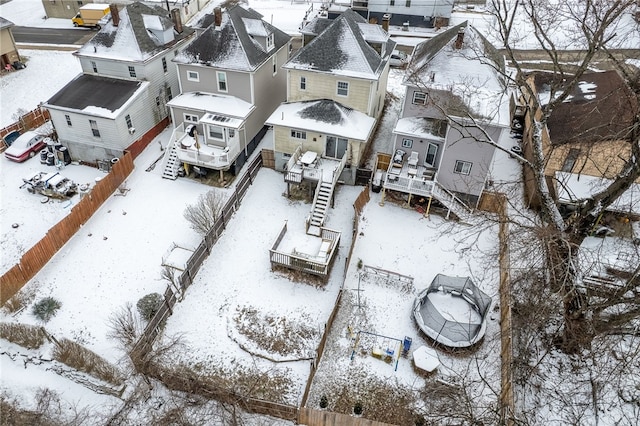 snowy aerial view featuring a residential view