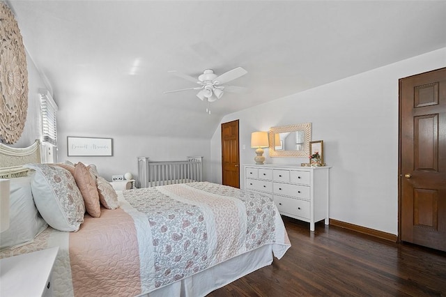 bedroom with a ceiling fan, lofted ceiling, dark wood-style flooring, and baseboards