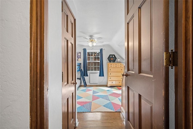 interior space with lofted ceiling and wood finished floors