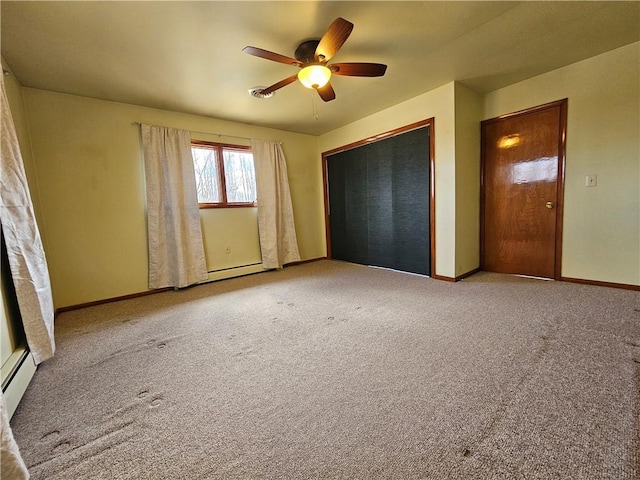 unfurnished bedroom featuring a closet, baseboards, carpet, and ceiling fan