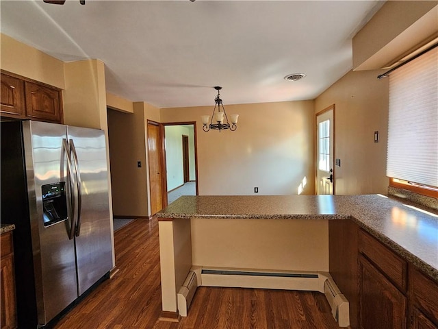 kitchen with visible vents, a notable chandelier, stainless steel fridge, baseboard heating, and dark wood-style flooring