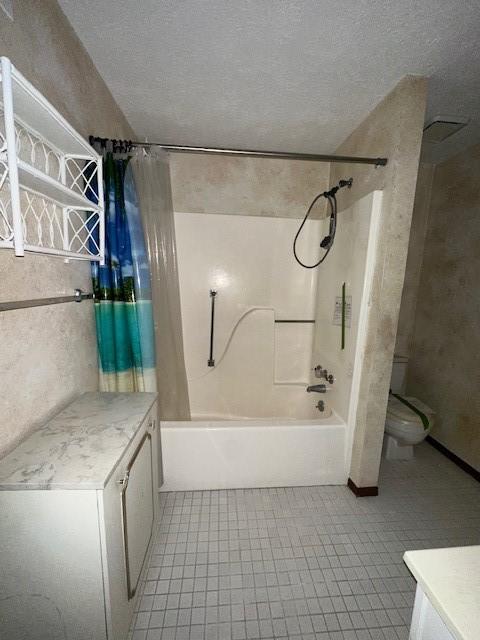 full bathroom with shower / tub combo with curtain, a textured ceiling, toilet, and vanity