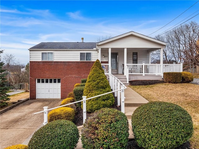 view of front of house featuring a garage, concrete driveway, a porch, and brick siding