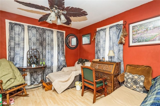 living area featuring ceiling fan and wood finished floors