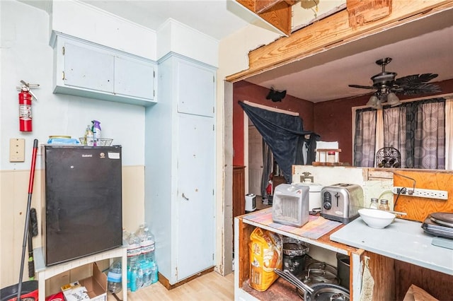 kitchen featuring ceiling fan and light wood-type flooring