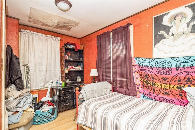 bedroom with wood finished floors