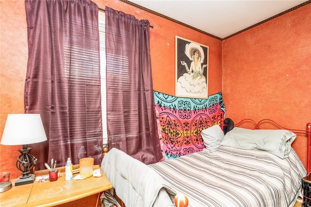 bedroom featuring crown molding