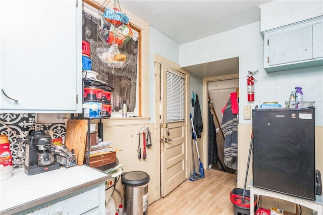 kitchen with light countertops and light wood-style flooring