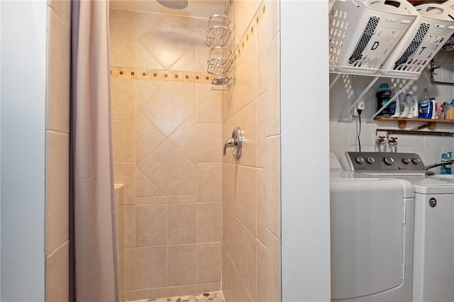 full bathroom featuring a shower stall and separate washer and dryer