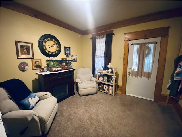 living area featuring carpet floors, a fireplace, and baseboards