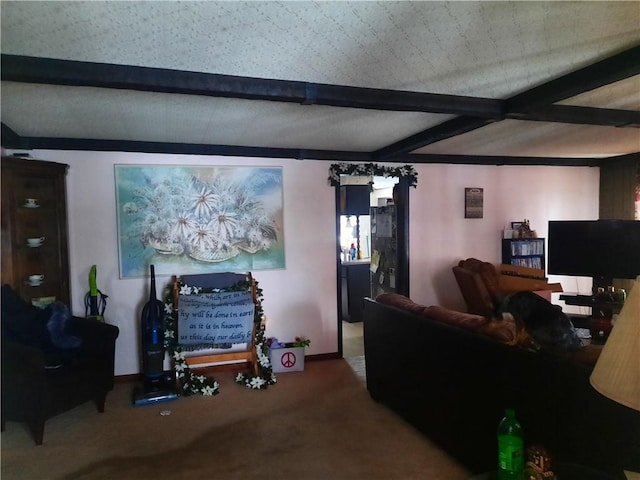 living area with carpet floors and beam ceiling