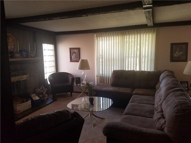 carpeted living room featuring a fireplace and beamed ceiling