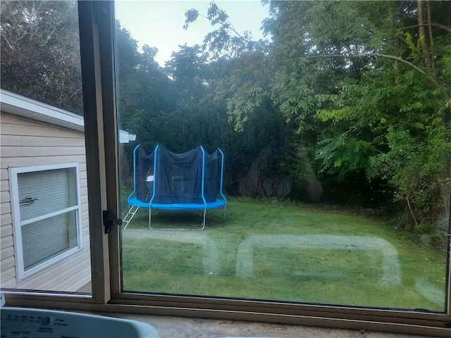 view of yard with a trampoline