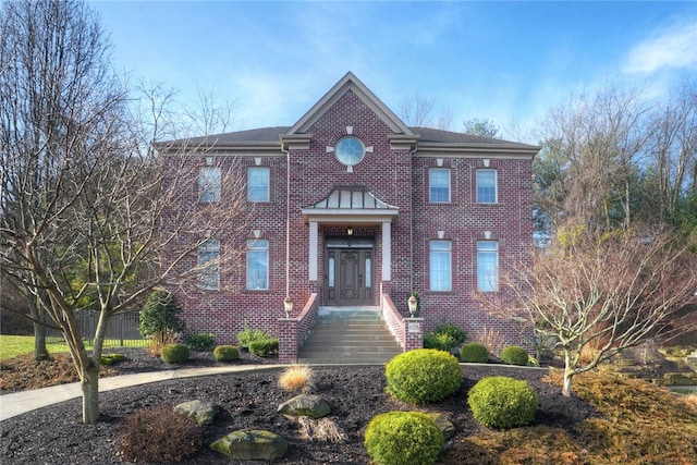 view of front of home featuring brick siding