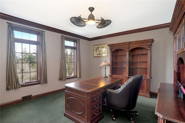 carpeted office featuring baseboards, visible vents, a ceiling fan, and ornamental molding