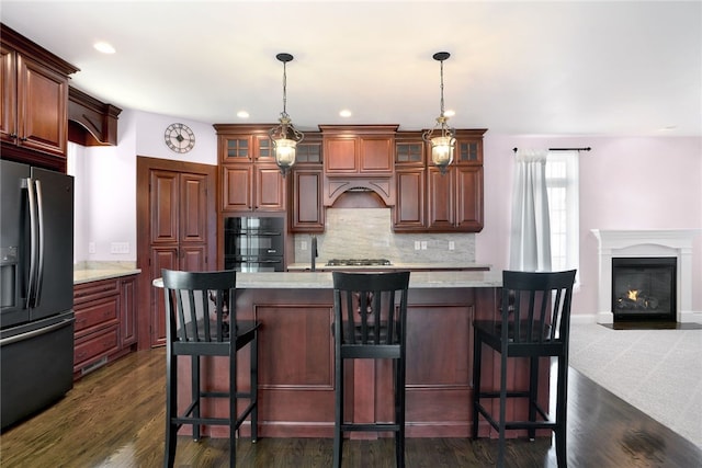 kitchen with tasteful backsplash, glass insert cabinets, fridge with ice dispenser, and dark wood-style floors