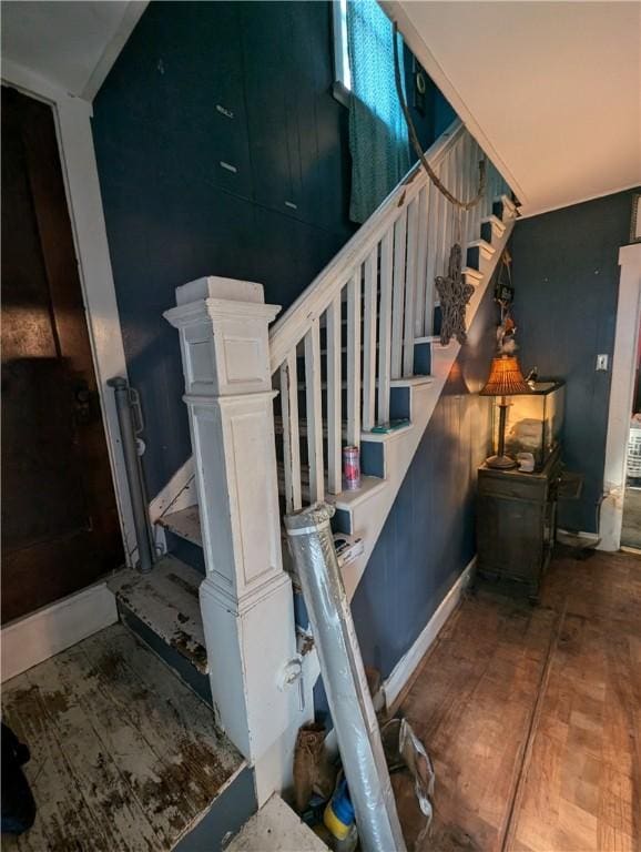 stairway featuring baseboards