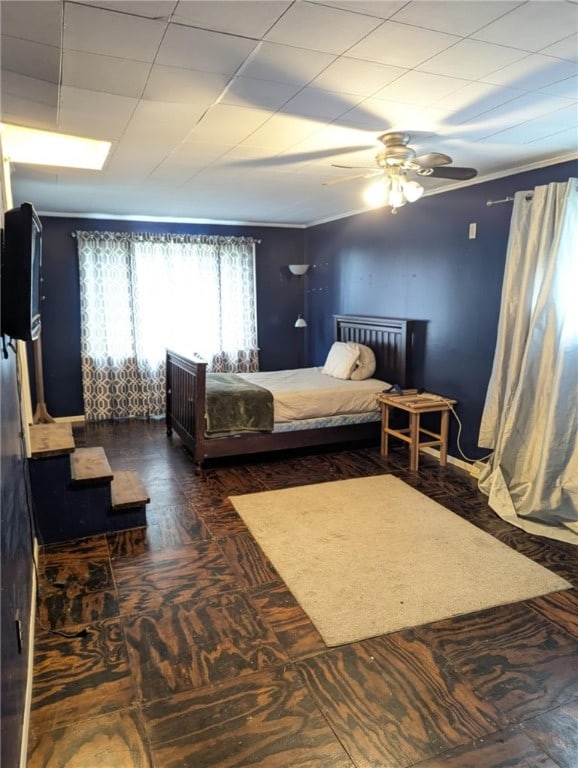 bedroom with a ceiling fan and wood finished floors