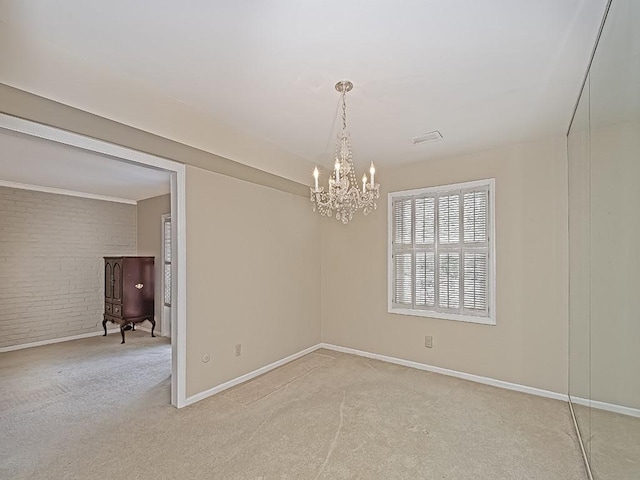 empty room with light carpet, brick wall, and baseboards