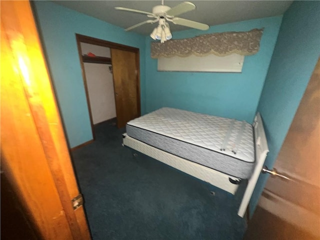 bedroom with ceiling fan, a closet, and carpet flooring