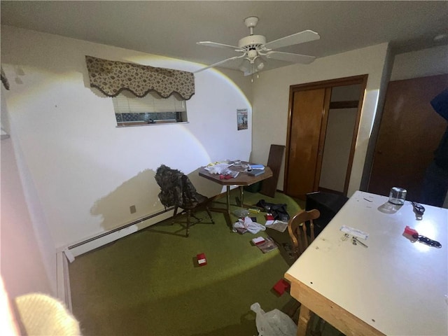 dining area with a baseboard radiator and a ceiling fan