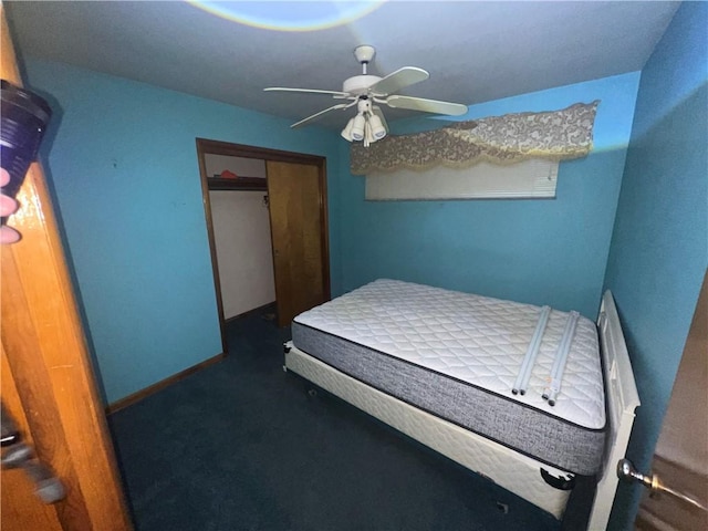 bedroom with a ceiling fan, baseboards, and a closet