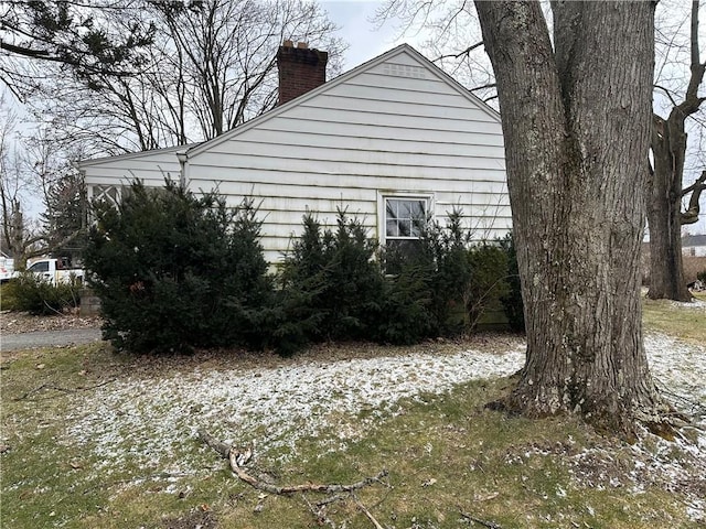 view of home's exterior with a chimney