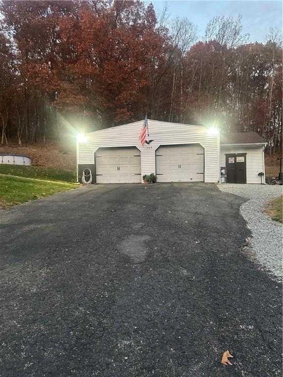 garage featuring driveway