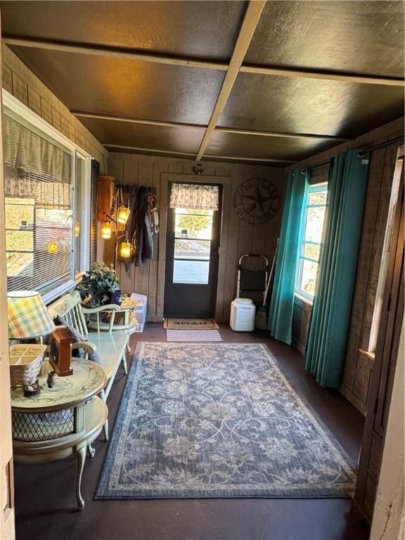 mudroom featuring wood walls