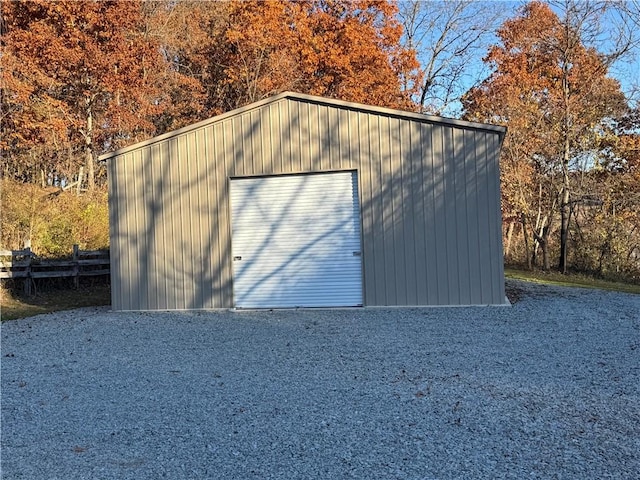 view of outbuilding with driveway and an outdoor structure