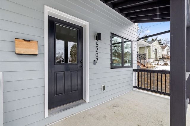 entrance to property featuring a porch