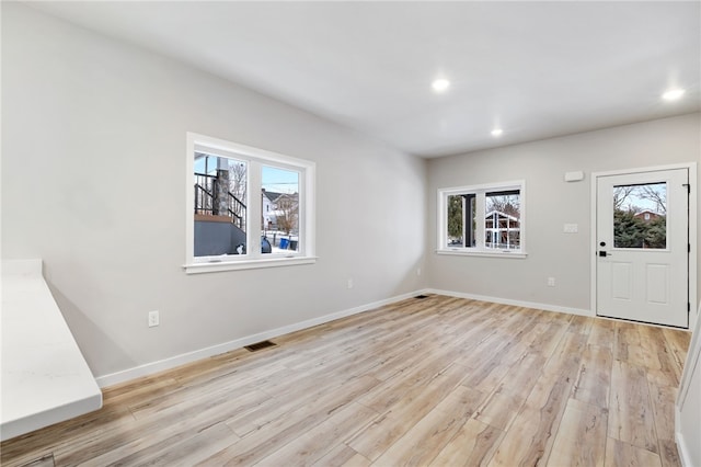 foyer featuring recessed lighting, baseboards, and light wood finished floors