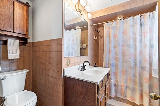 bathroom featuring a shower with shower curtain, toilet, tile walls, and vanity