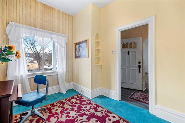 office featuring carpet flooring, baseboards, and wallpapered walls