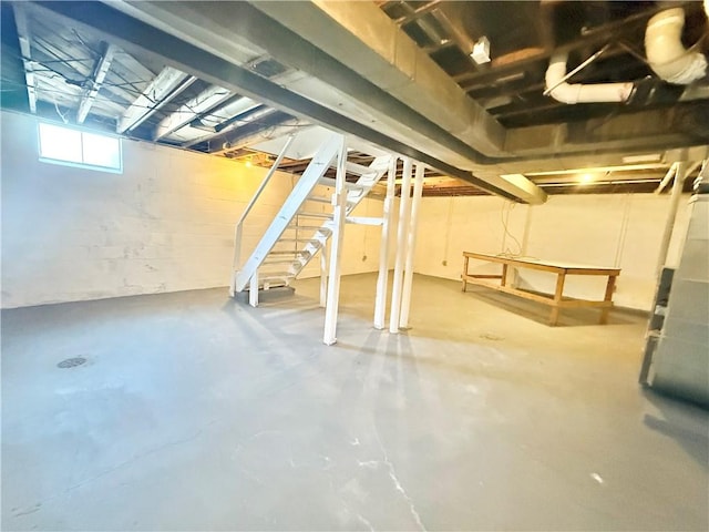 basement featuring stairs