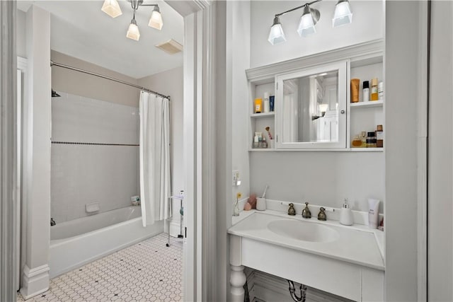 full bath with visible vents, shower / bathtub combination with curtain, and vanity