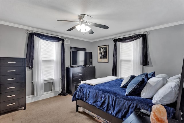 bedroom featuring a ceiling fan, light colored carpet, and crown molding