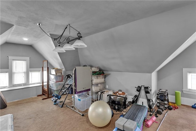 bonus room featuring lofted ceiling, carpet flooring, and baseboards