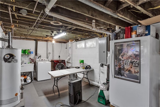 below grade area featuring separate washer and dryer, a sink, water heater, electric panel, and refrigerator with glass door