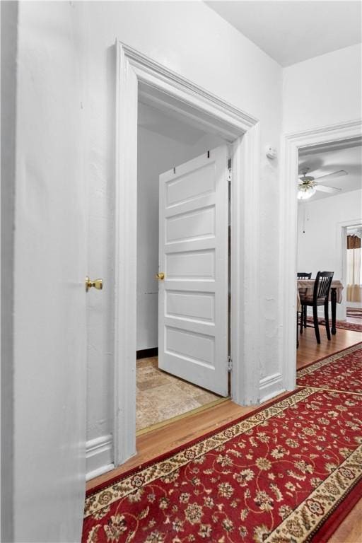 hall with wood finished floors